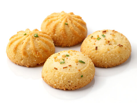 Goan bolinhas, traditional coconut semolina biscuits shaped into small rounds, golden crisp surface,