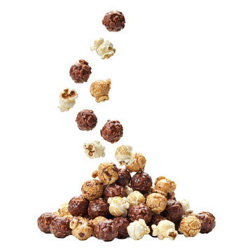 A pile of mixed chocolate coated and salty popcorn kernels falling downwards in a vertical stream isolated on a transparent background
