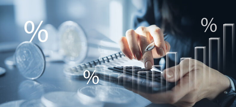 Business finance, investment  and accounting concept. Businesswoman using calculator to calculate financial report, budgeting and tax calculation