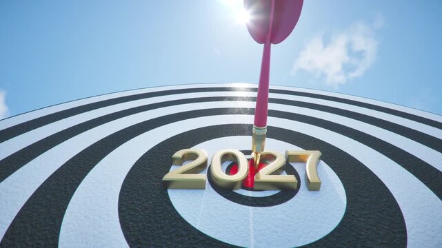 Slow motion Red dart arrow Hitting on bullseye under clear sky. 2027 goal setting focus concept. 3D animation. Selective focus.