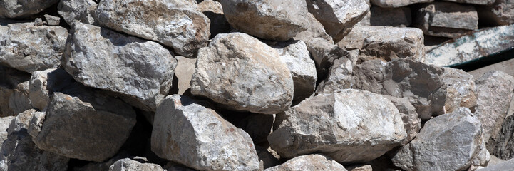 Panorama of loose rock boulder stones for use as a background texture © Chris Lawrence