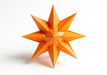 Fototapeta premium Vibrant orange origami star with sharp geometric points isolated on white.