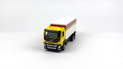 Fototapeta premium Kediri, East Java, Indonesia – September 4, 2026: LEGO Toy Truck Model with Colorful Cargo Box Displayed on White Background