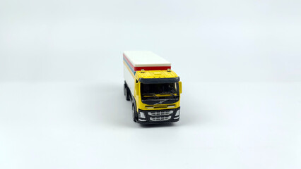 Fototapeta premium Kediri, East Java, Indonesia – September 4, 2026: LEGO Toy Truck Model with Colorful Cargo Box Displayed on White Background