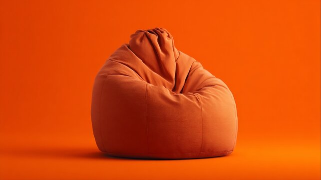 Vibrant orange bean bag chair on an orange background, a comfortable and modern piece of furniture with rich texture.