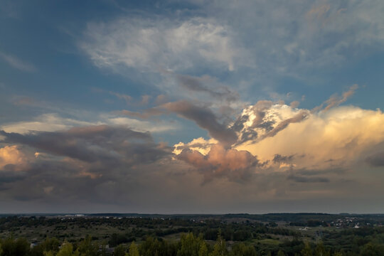 Beautiful thunderclouds at sunset over the countryside