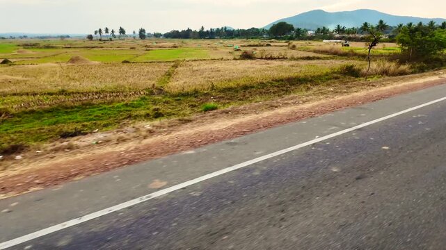 Rural Farmland Passing Beside National Highway From Moving Vehicle in Odisha, India