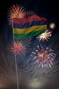 Waving National flag of Mauritius and holiday fireworks in night sky
