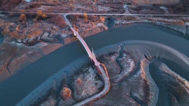 Aerial drone 4K view of the unique Bicycle Bridge (Misaeng Bridge) over muddy tidal flats in Sorae Wetland, South Korea
