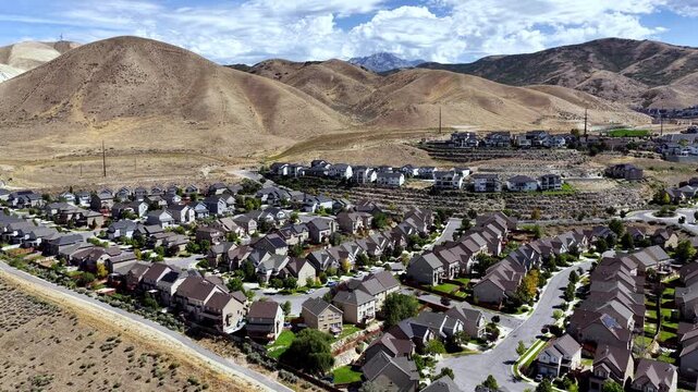 New suburban housing neighborhood on Lehi&rsquo;s urban edge on Travers Mountain and Silicon Slopes - forward aerial flyover