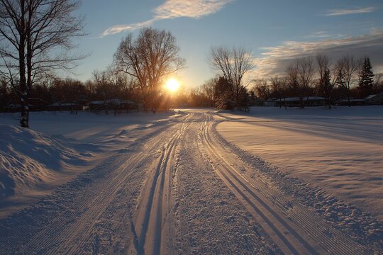 sunrise over cross country ski tracks in fresh snow