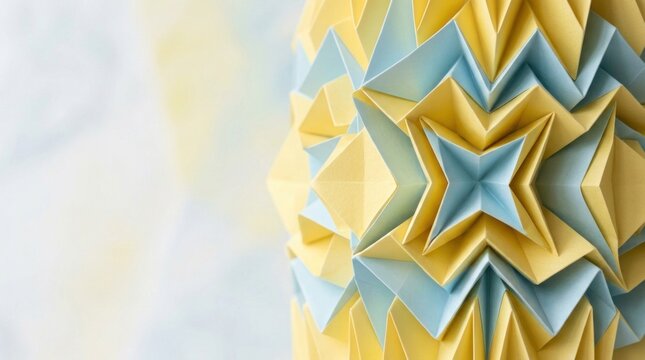 Intricate accordion pleated paper origami sculpture featuring geometric yellow and blue facets