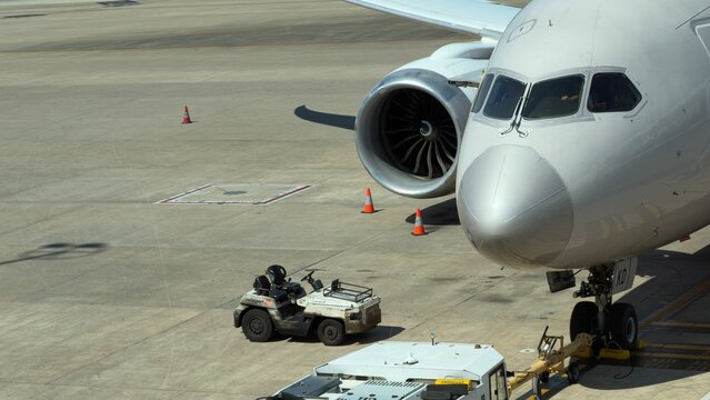 Commercial Passenger Jet Nose and Engine on Airport Tarmac