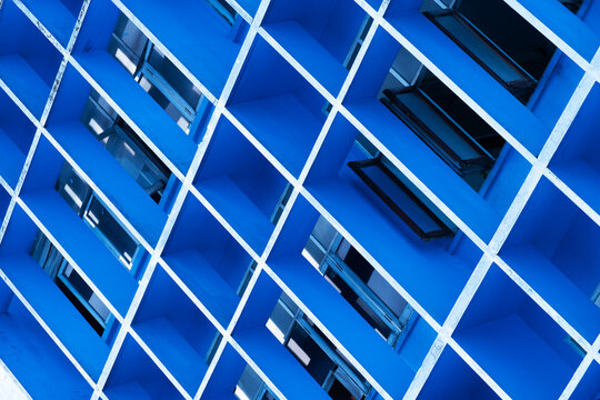 modern concrete office building in colorful blue architecture background