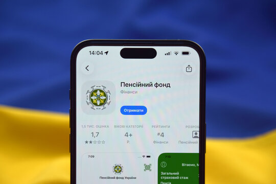 The Pension Fund app for citizens of Ukraine on a smartphone screen against the background of the flag of Ukraine.