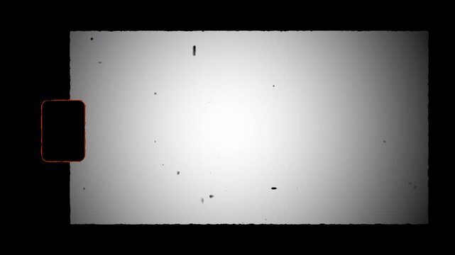 Real 8mm Film. Authentic Super 8 Film Frame Scan with sprocket hole, Film Grain Overlays. Real hard 8 mm film vintage cinematic texture with grain and dust.  4K Video. 