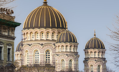 Golden striped domes of the Nativity of Christ Cathedral rise over Riga, Latvia © venemama
