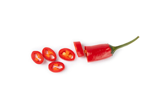 Red chili pepper isolated on white background. Fresh slice of hot pepper. Vegan, vegetable. Pepper cut into slices on a white background close-up.