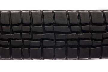 Fototapeta premium Black rubber vehicle tire tread texture, close up of automotive wheel surface pattern.