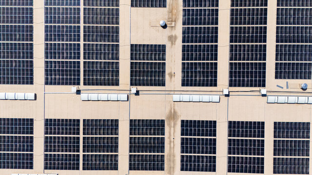 Aerial view of a large solar panel installation on a flat roof in Sabac, Vojvodina, Serbia.
