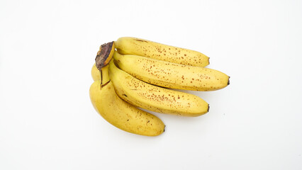 Fresh Yellow Bananas on a White Background Displaying Natural Spots and Vibrant Colors © indraprojects
