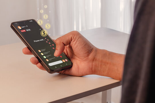 A man generating revenue via live streaming apps. Digital monetization in the mobile era.