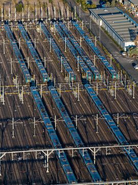 Aerial view of Sydney Metro driverless train fleet parked at the stabling sidings, featuring electrified railway tracks and modern train carriages in Tallawong, New South Wales, Australia.