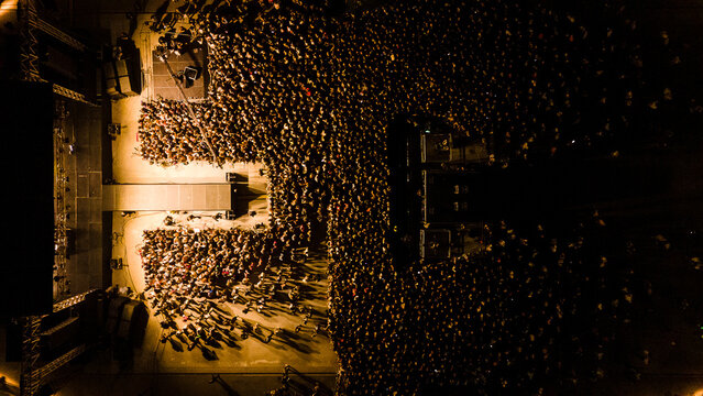 Aerial view of a large crowd gathered at Tasmajdan Stadium for a night concert, illuminated by stage lights in Beograd, Grad Beograd, Serbia.