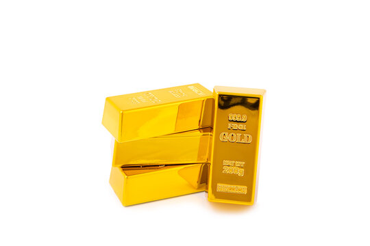Gold bars isolated on white background. Stack of many shiny gold bars. Fine gold concept. Gold panel background.  Metallic texture. Wealth, luxury, treasure.