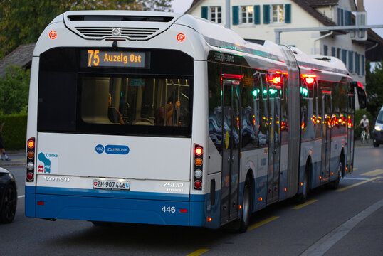 Rear view of VBZ public transport Volvo hybrid bus destination Auzelg Ost passing at Swiss city of Z&uuml;rich on a summer evening. Photo taken September 4th, 2026, Zurich Schwamendingen, Switzerland.