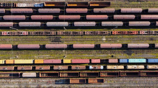 Aerial view of Train Station Zeleznik with rows of freight train cars parked on parallel tracks in Belgrade, City of Belgrade, Serbia.