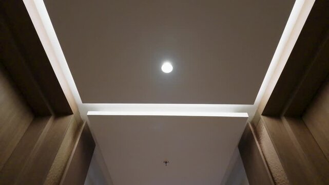 Modern Interior Corridor with Minimalist False Ceiling Design and Recessed Lighting.