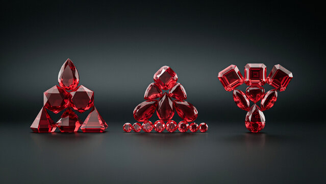 Three distinct arrangements of polished red gemstones on a dark gray background surface