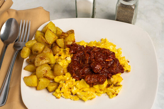 pulled pork  on scramble eggs