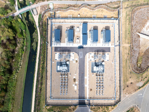 Aerial view of Google Data Centre - Waltham Cross showing technical infrastructure, power equipment, and security fencing in Cheshunt, England, United Kingdom.