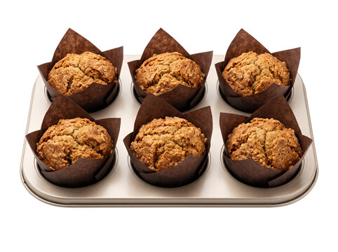 Six Baked Muffins in Tulip Liners on Baking Tray Isolated