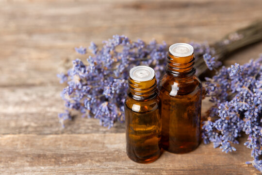 Lavender essential oil in glass and bottles with fresh lavender fowers. Natural aromatherapy. Organic skincare. Herbal cosmetic serum. Spa wellness treatment. Botanical Extract, beauty and self care