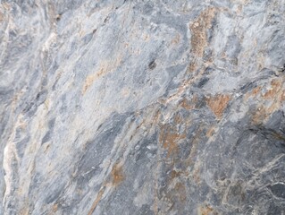 Raw stone background with smooth-yet-rough texture, cool gray base with warm brown and rust-colored...