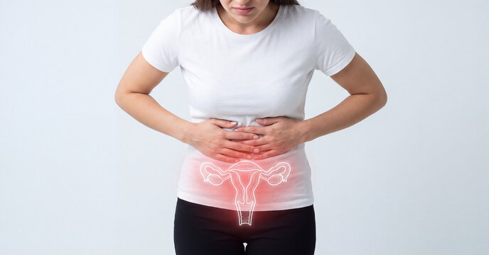 Woman suffering from abdominal pain with highlighted uterus anatomy for medical concept