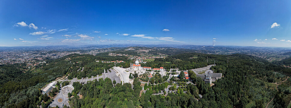 Aerial view of the Sanctuary of Our Lady of Sameiro surrounded by lush green forests and the urban landscape of Braga, Braga, Portugal.