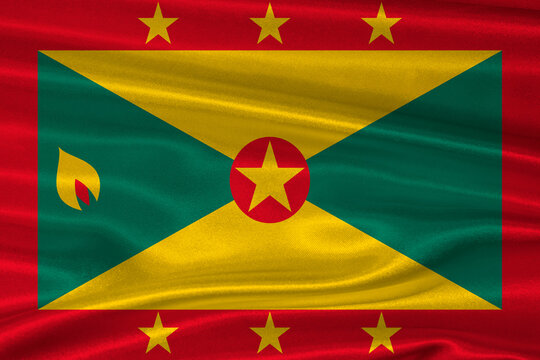 Grenada flag textured with fabric background. Flag of Grenada with a soft fabric texture