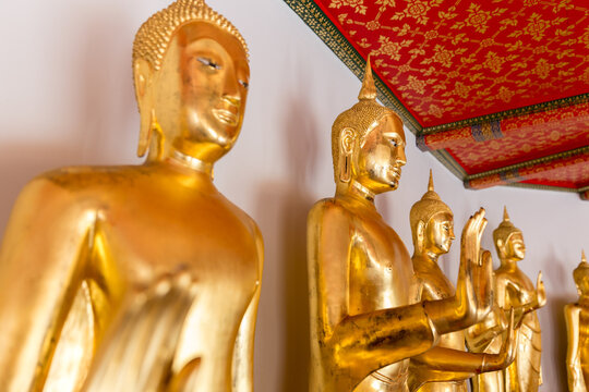 Golden Buddha Statues Standing in Thai Temple