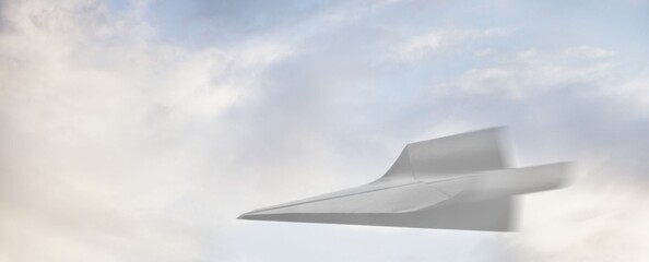 Silent jet glides through soft, cloudy sky. Sharp design hints at speed and modern engineering. Motion blur suggests swift, powerful movement. Ideal for aviation, innovation, or futuristic themes © Issarawat Tattong