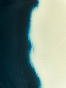 Aerial view of abstract blue and cream textured surface Iceland.