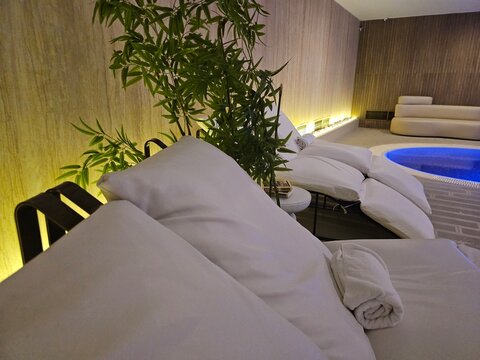 Relaxing area with seating and a small pool