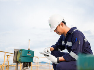 Petrochemical engineering checking controllers crude oil storage tank factory and industry. Maintenance engineer analysis work manufacturing production palm oil at refinery industrial plant. Fuel gas © Яe Life Яe World