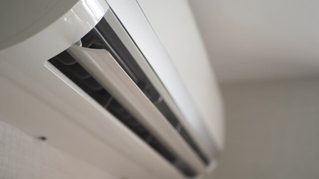 Air conditioner cooling unit swinging flaps for ventilation in modern room
