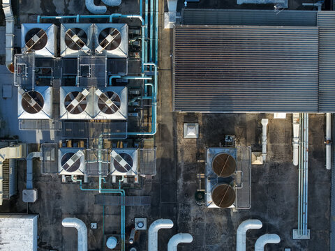 Wantirna South, Victoria, Australia - 03 September 2026: Aerial view of Knox Data Centre featuring industrial cooling towers, ventilation pipes, and metal roof structures.