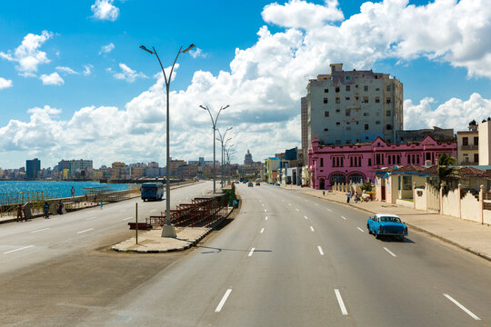 Malecon Coastal Boulevard in Havana Cuba with Vintage Car