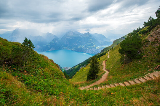 Beautiful  view of the Stoos ridge hike trail overlooking a turquoise lake near Stoos mountain village, Switzerland.